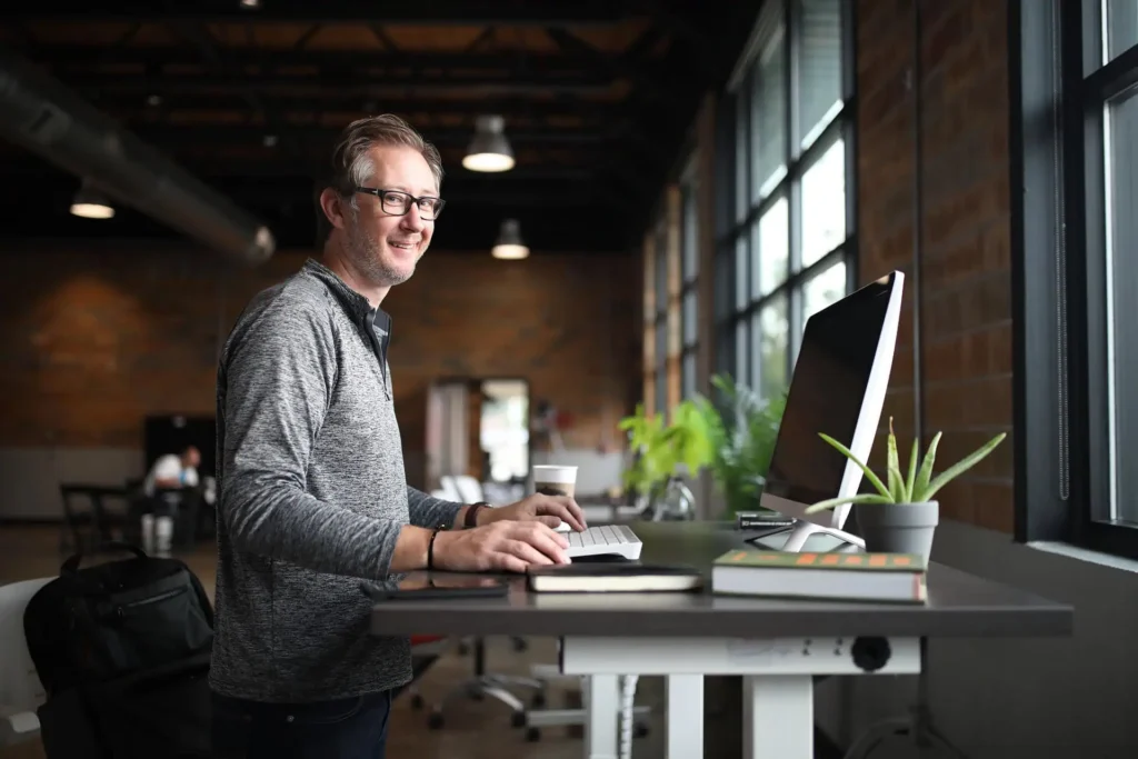 Man working at standing desk in modern office space